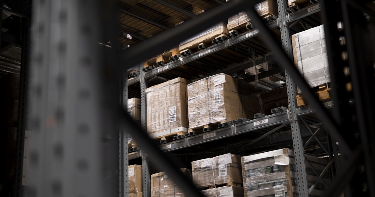 Modern bonded warehouse interior with pallets and racking systems — Cyprus customs warehousing guide