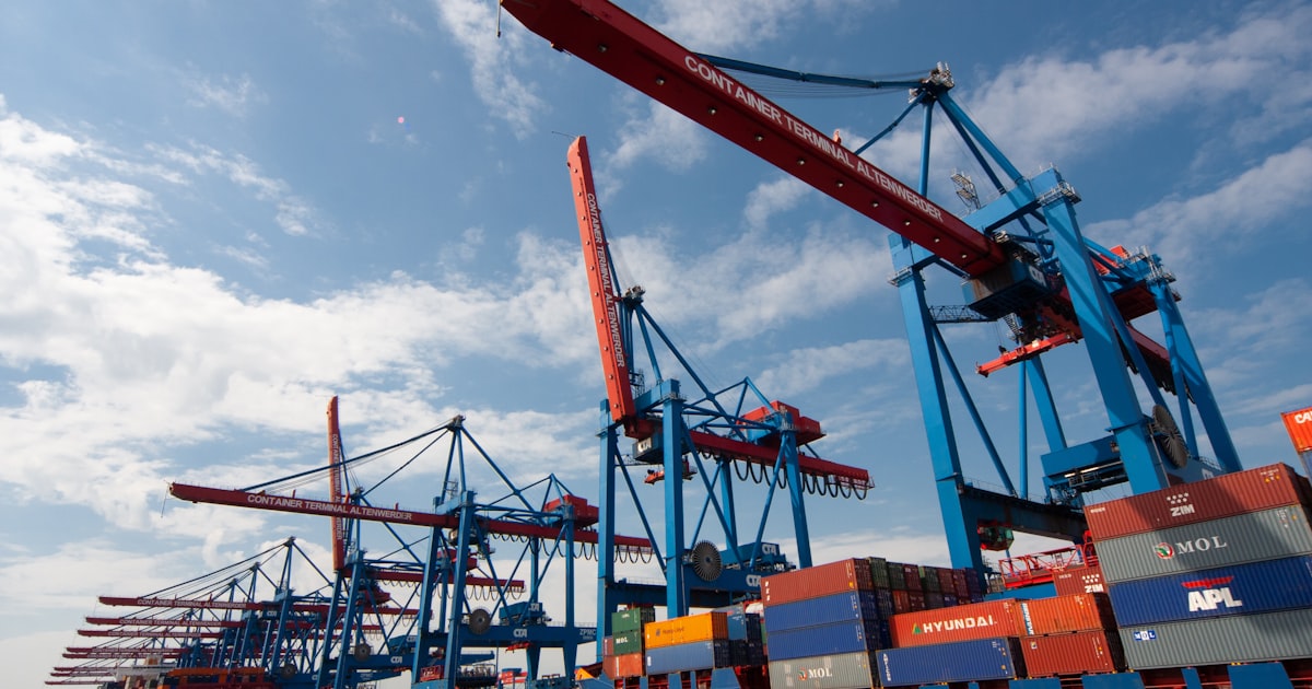 Cargo containers being loaded onto a ship at Limassol Port, Cyprus — export customs clearance